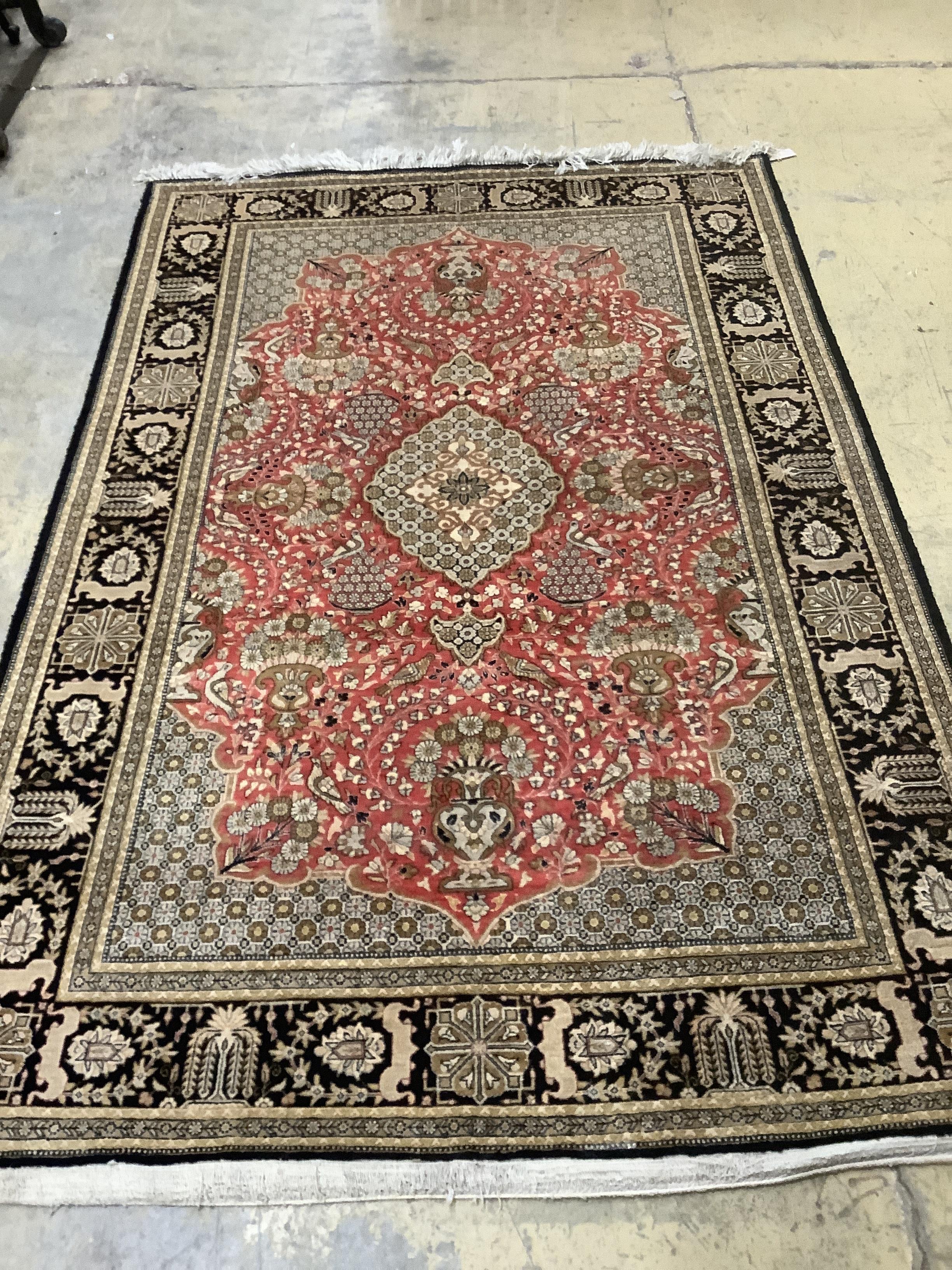 A North West Persian brick red ground rug, 215 x 140cm